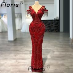 a red evening gown on display in a store