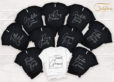 black and white t - shirts with the names of each member in their signatures