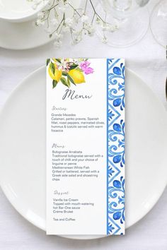 a white plate topped with a blue and yellow menu