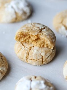 several cookies with white powdered sugar on them