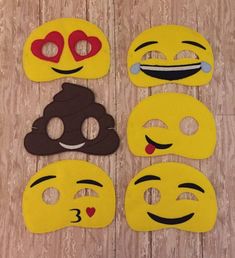 four different types of emoticive masks on a wooden surface with the words garden district quilts