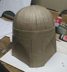 a paper model of a helmet on top of a table