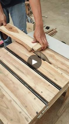 a person cutting wood with a large knife