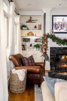 a living room filled with furniture and a fire place