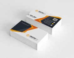 two business cards with an orange and black design on the front one is folded in half