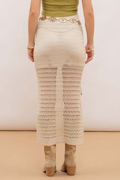 Expertly crafted with an elasticized waist for a comfortable and flexible fit, this Natural Crochet midi skirt features a straight cut and ribbed hem for a flattering silhouette. The knit design is lined for added coverage, making it a versatile and stylish choice for any occasion. Fabric & fit:SHELL: 93%ACRYLIC, 7%NYLONLINING: 100%POLYESTER Model is wearing size small. Fitted Pointelle Knit Bottoms For Spring, Spring Fitted Pointelle Knit Skirt, Fitted Pointelle Knit Skirt For Spring, Spring Ribbed Beige Skirt, Chic Ribbed Maxi Skirt For Spring, Spring Midi Ribbed Skirt, Chic Ribbed Long Skirt, Chic Long Ribbed Skirt, Spring Ribbed Stretch Maxi Skirt