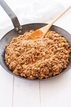 a skillet filled with ground beef and spices