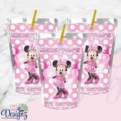 three pink minnie mouse birthday bags with yellow straw toppers and polka dots on them