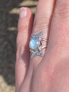 Gorgeous, natural rainbow moonstone Sterling Silver ring, size 7.5. Surface dimensions: 19mm x 9mm. Stone dimensions: 9mm, round. Band width: 3mm. Bohemian Multi-stone Moonstone Ring, Spiritual Moon-shaped Moonstone Ring, Bohemian Sterling Silver Cabochon Moonstone Ring, Silver-tone Opal Ring With Cabochon Moonstone, Bohemian Silver Moonstone Ring Nickel-free, Crescent Ring, Moonstone Pendant Necklace, Black Moonstone, Moonstone Ring Sterling Silver