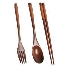 three wooden utensils and two spoons on a white background