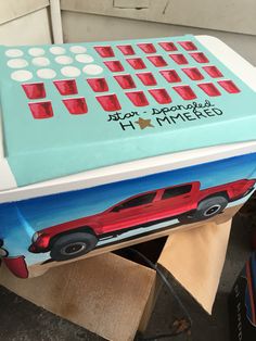 a cake shaped like a computer keyboard with red cups on it's top and bottom