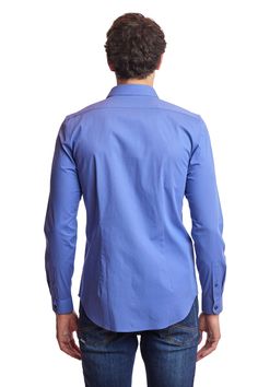 An elegant slim-fit spread collar shirt in a rich blue color. Poly-rayon stretch gives this shirt a comfortable, yet elegant appearance that can be worn all year long. This shirt can be worn with a variety of tops and bottoms.PRODUCT DETAILS: style 6537W slim fit dress shirt spread collar printed fabric poly-rayon stretch blend dry clean only imported