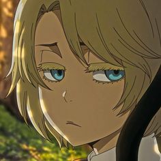 an anime character with blonde hair and blue eyes looks at the camera while standing in front of trees