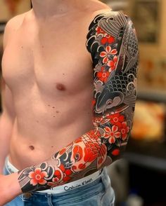 a man with a tattoo on his arm