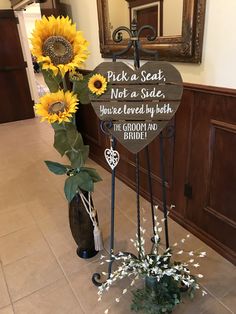 sunflowers are arranged in vases next to a sign that says pick a seat not a side