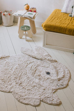 an elephant rug is on the floor in a child's room with white floors