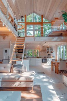 a living room filled with furniture and a spiral staircase leading up to the top floor