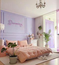 a bedroom decorated in pastel pink and lavender tones