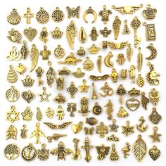 many different types of charms on a white surface