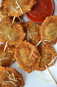 small appetizers with toothpicks and sauce on a plate