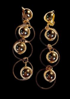 Very pretty and attractive design Medium  sized  Gold ball bead and hoop clip on Earrings Super light design These hang 3 inches  Very light on the ear  Sturdy metal  clip on closure Clip-on Dangle Hoop Earrings For Party, Party Clip-on Dangle Hoop Earrings, Hammered Metal, Light Design, Rhinestone Studs, Classic Gold, Gold Studs, Chicago Il, Up Hairstyles