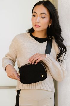 A chill in the air calls for cozy accessories. Enter: The Aspen Sherpa Belt Bag. With its soft fleece material, adjustable strap (intended to fit over sweaters, vests, and coats), and glam gold hardware, you're sure to be reaching for this fanny pack all season long. Details: 8.5" long x 5.5" height x 2.25" wide Back zippered pocket is 6.5" long x 4" wide (fits a phone!) Strap adjusts from 21"-39" end to end 3 interior mesh pockets Fuzzy soft sherpa fabric Stunning contrasting gold hardware Sherpa Belt Bag, Black Belt Bag, Sherpa Fabric, Cozy Accessories, Phone Strap, Hottest Fashion Trends, Timeless Accessories, Boutique Brands, Modern Chic