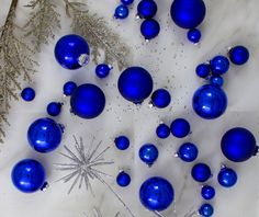 blue ornaments are arranged on a white surface