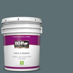 a bucket of behr paint and primer in one on a light blue background