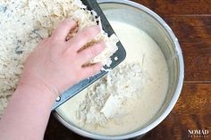 someone using a spatula to mix ingredients in a bowl