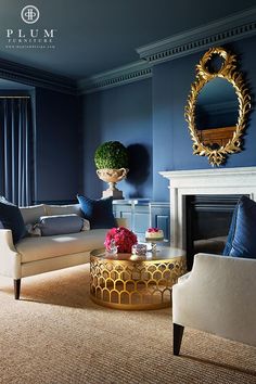 a living room with blue walls and furniture