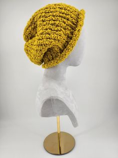 This beautifully golden knit hat was made by Dahlia herself! Dahlia is a 33 year old special needs adult with Down Syndrome. Knitting is her absolute favorite thing to do and she is ecstatic to share her creations with you! We hope you like texture because this wool cap is knitted with thick, soft bouclette (looped) yarn. With a loose fit, you will be comfortable AND stylish. Thank you for looking! Yellow Yarn Crochet Hat, Yellow Yarn Crochet Cap, Yellow Crochet Yarn Cap, Yellow Crochet Cap Hat, Slouchy Knit Beanie Hat, Adjustable Yellow Crochet Beanie Hat, Yellow One Size Fits Most Beanie, Adjustable Yellow Knitted Hat, Yellow Yarn Hat One Size