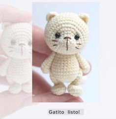 there is a small crocheted cat on the finger