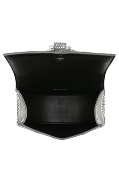 The curvilinear silhouette of this crystal-coated calfskin-suede satchel recalls the exaggerated shapes often used by master couturier Cristóbal Balenciaga. Sparkling B-logo hardware amps up the impact, while a removable crossbody strap (also covered in crystals) offers a hands-free carrying option. 7"W x 4.5"H x 2.5"D Magnetic-snap flap closure Top carry handles; removable, adjustable crossbody strap Leather lining Leather Made in Italy Designer Handbags High-end Silver Formal Bag, High-end Shoulder Bag With Silver-tone Hardware For Evening, High-end Evening Shoulder Bag With Silver-tone Hardware, Luxury Shoulder Bag With Palladium Hardware For Parties, High-end Top Handle Evening Bag, Luxury Top Handle Evening Bag For Events, Luxury Evening Bag With Top Handle For Events, Silver Leather Evening Bag For Formal Occasions, Modern Silver Evening Bag For Formal Events