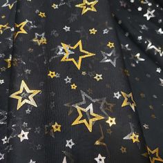 black and gold stars printed fabric