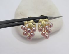 Material : Genuine Natural Pink Freshwater Pearl in 925 Sterling Gold Posts Quantity : One Pair earring Pearl Color : Natural Pink Freshwater Pearls Shape : Round pearls Pearl Size : 2-3mm approx. Earring Length : 0.75inch approx. *Due to they are naturally grown, they won't be identical on each one. Lead Time & Shipping : We will ship your order in 24 hours once we received your order. If we offer FREE DOMESTIC shipping, package will be shipped via USPS First Class mail on orders shipping w Pink Clip-on Earrings For Anniversary, Pink Round Pearl Earrings For Pierced Ears, Pink Formal Pearl Earrings, Formal Pink Pearl Earrings For Pierced Ears, Pink Dangle Pearl Earrings For Formal Occasions, Earring Pearl, Grape Earrings, Cultured Pearl Necklace, Earrings Pearl