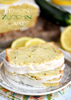 lemon zucchini cake on a plate with slices cut out