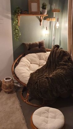 a room with a round bed and pillows on the floor