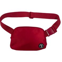 a red fanny bag with a black starbucks logo on the front and one strap attached to it