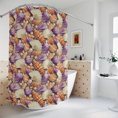 a shower curtain with shells on it in a bathroom