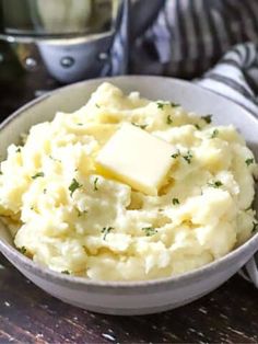 mashed potatoes with butter and parsley in a bowl