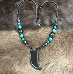 Authentic Native American Indian Navajo Hematite, and Kingman Turquoise necklace with Large Hematite Bear Claw Pendant.  Necklace length is approximately 30 inches. Handcrafted by Navajo Artist F. Sellers Great for a Gift❤️ True to the origin of "hema", the hematite gem is believed to bring positivity and health to the bloodstream of the wearer, energizing the person from within. Stretch Beaded Bracelets Diy, Bear Claw, Bear Claws, American Indian Jewelry, Bracelets Diy, Southwestern Jewelry, Beaded Bracelets Diy, Kingman Turquoise, Native American Indians