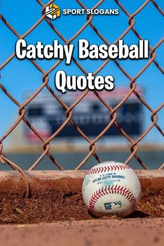 a baseball sitting on top of a dirt field next to a chain link fence with the words catchy baseball quotes