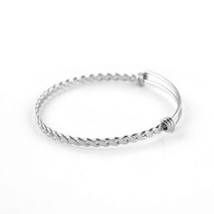 Quantity: 50 pieces per lot  Material: High quality Stainless Steel with high quality polishing process to achieve smooth and shiny appearance Color: Dark Silver tone Stainless Steel Base Color Dimension:  - Bangle Width :  About 3.8 mm - Bangle Sizes : 60 mm / 2.4 inches for Regular women wrist Perfect Gift for any occasion. You can add it as one of the stackable bracelets to mix and match other design of bracelets. Add your own charms to create unique theme or story for these bangles bracelets. It would be a great gift to anyone who is your special on. OR just simply wear single pieces or multiple pieces of these plain cable twist bangles on their own preference. Wire Bangle Bracelets, Twisted Bangle, Wire Bangles, Bangles Bracelets, Stackable Bracelets, Cuff Bangles, Stainless Steel Jewelry, Bangle Bracelet, Charm Jewelry