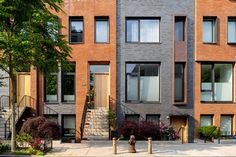 an apartment building with many windows and stairs