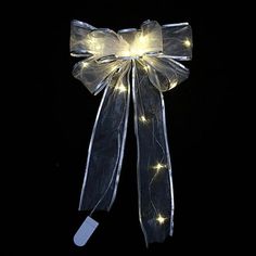 a lighted bow on a black background