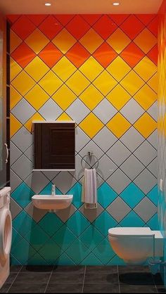 a bathroom with colorful tiles on the walls and floor, along with a toilet and sink