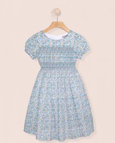 Demoiselle Liberty Carmella Daisy Blue Dress - Dress Short Sleeve Smock Floral Dress For Garden Party, Blue Dress With Smocked Fitted Bodice, Fitted Smocked Dress With Ditsy Floral Print For Daywear, Fitted Smocked Dress With Smocked Cuffs For Garden Party, Fitted Floral Dress With Smocked Bodice For Daywear, Blue Smocked Dress For Garden Party, Blue Ruched Smocked Dress For Garden Party, Blue Dress With Smocked Cuffs For Garden Party, Liberty Floral