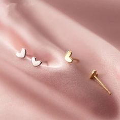 The Mini Heart Studs are the perfect, dainty earring that goes with everything! They are available in gold vermeil and sterling silver and are hypoallergenic, tarnish and wear resistant, and perfect for sensitive ears. They are the ideal dainty accessory and are great for a first piercing or as a second/third piercing. Gold Heart Stud Earrings, Tiny Gold Studs, Gold Heart Studs, Gold Heart Earring, Teen Jewelry, Mini Studs, Tiny Studs, Heart Stud Earrings, Tiny Earrings