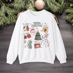 Get into the holiday spirit with this family Christmas sweatshirt. Perfect for matching family Christmas gatherings, this cozy sweatshirt is made with a medium-heavy fabric blend of 50% cotton and 50% polyester, providing warmth during the colder months. The classic fit and crew neckline offer a comfortable wearing experience with added durability from the double-needle stitching. Say goodbye to itchiness with the tear-away label. Ideal for families looking to coordinate their holiday attire wit Holiday Attire, Christmas Gathering, Holiday Sweatshirt, Sweatshirt Christmas, Cozy Sweatshirts, Christmas Sweatshirts, All Things Christmas, Christmas Sweater, Family Christmas