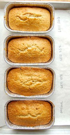 three loafs of bread sitting in a pan